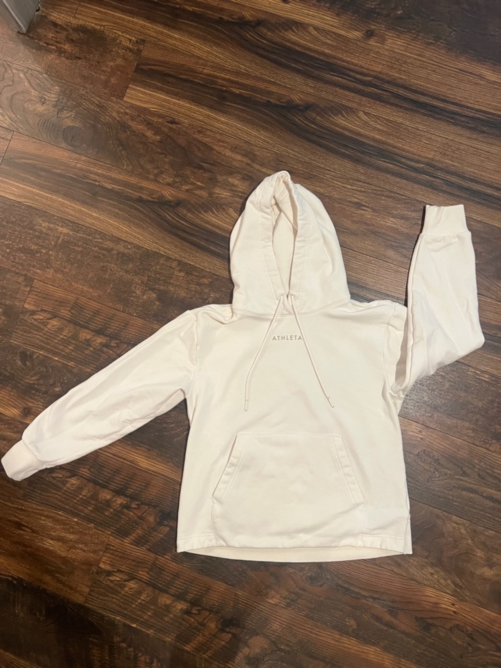 Cream colored Athleta hoodie with front pocket excellent condition